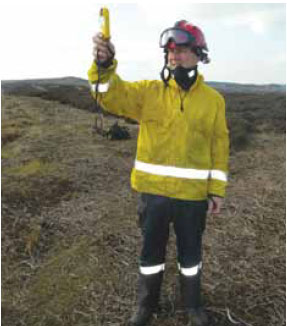 Photo B2.1 A wildfire specialist using a hand-held weather unit