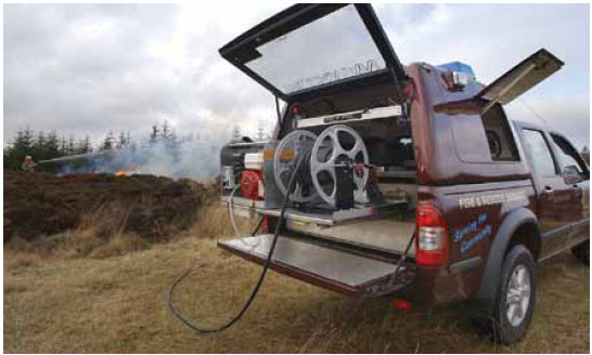 Photo B8.1 A photograph of a wildfire vehicle equipped with a fogging unit which can provide water support to hand crews